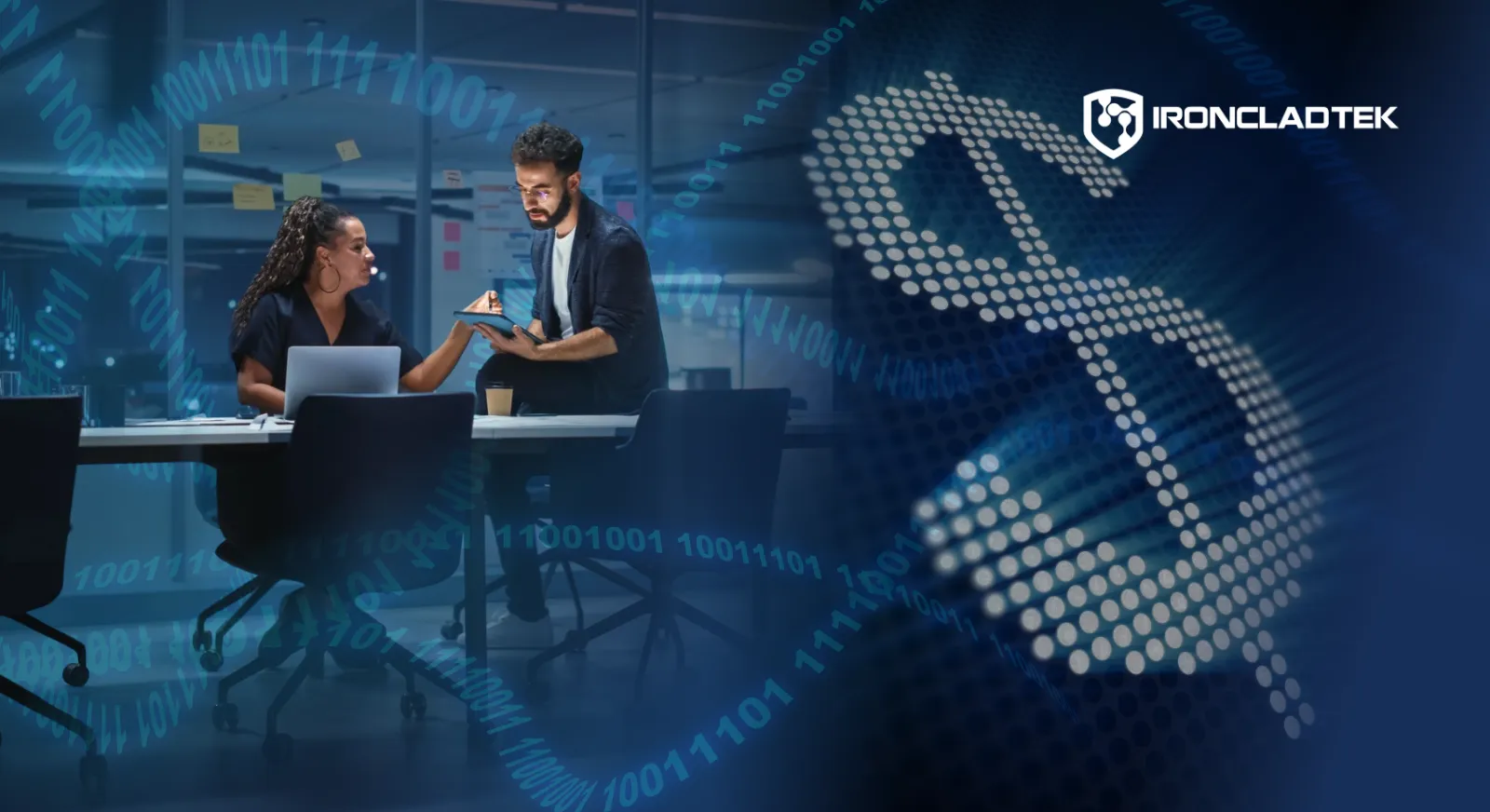 The image represents the theme and title of the article: The Real Cost of a Cybersecurity Breach (And Why It’s More Than the Ransom). There is a photo of two people sitting in an office, and on the right handside, a large dollar sign composed of digital nodes.